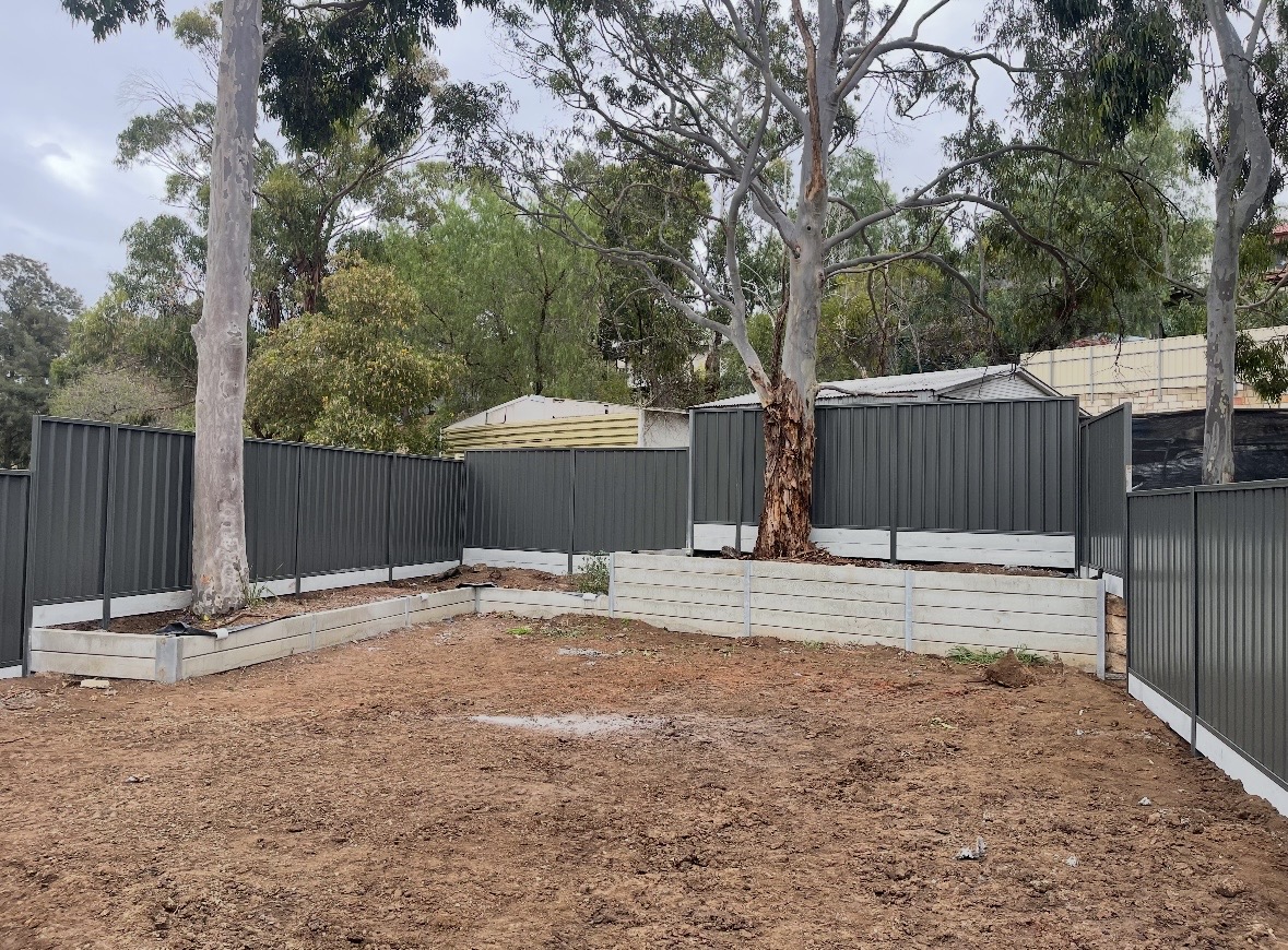 Engineered retaining wall built on a sloped Adelaide block
